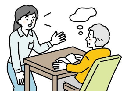 机に座る高齢者に対して、立って説明をしている女性スタッフのイラスト